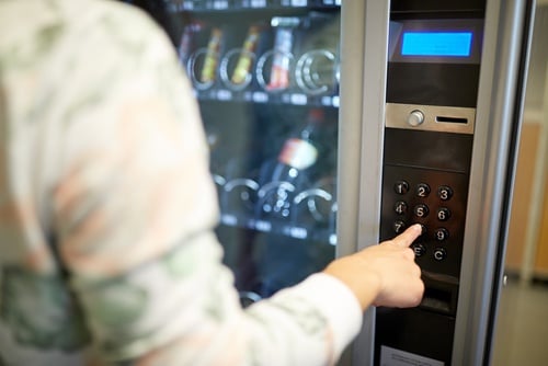 Person using vending machine at hotel