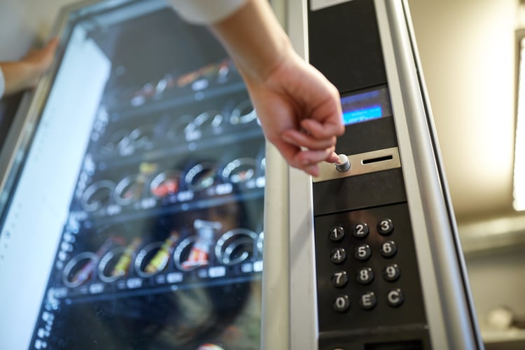 woman using a vending machine